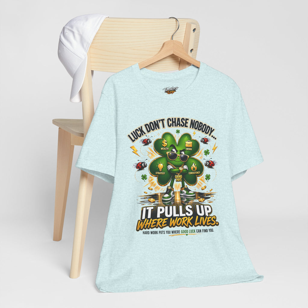 TimeWarp Drip Luck Don't Chase Nobody black 4-Leaf Clover tee flexes on a wooden chair, stuntin' next to a crisp white cap. Street drip!. streetwear apparel