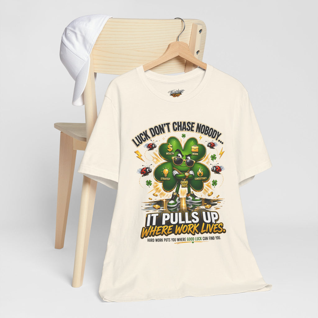 The Lucky Clover "Pulls Up Lives" Graphic T-Shirt by TimeWarp Drip features a four-leaf clover in sunglasses and chains, plus "LUCK DONT CHASE NOBODY... IT PULLS UP WHERE WORK LIVES." Available in S–3XL.