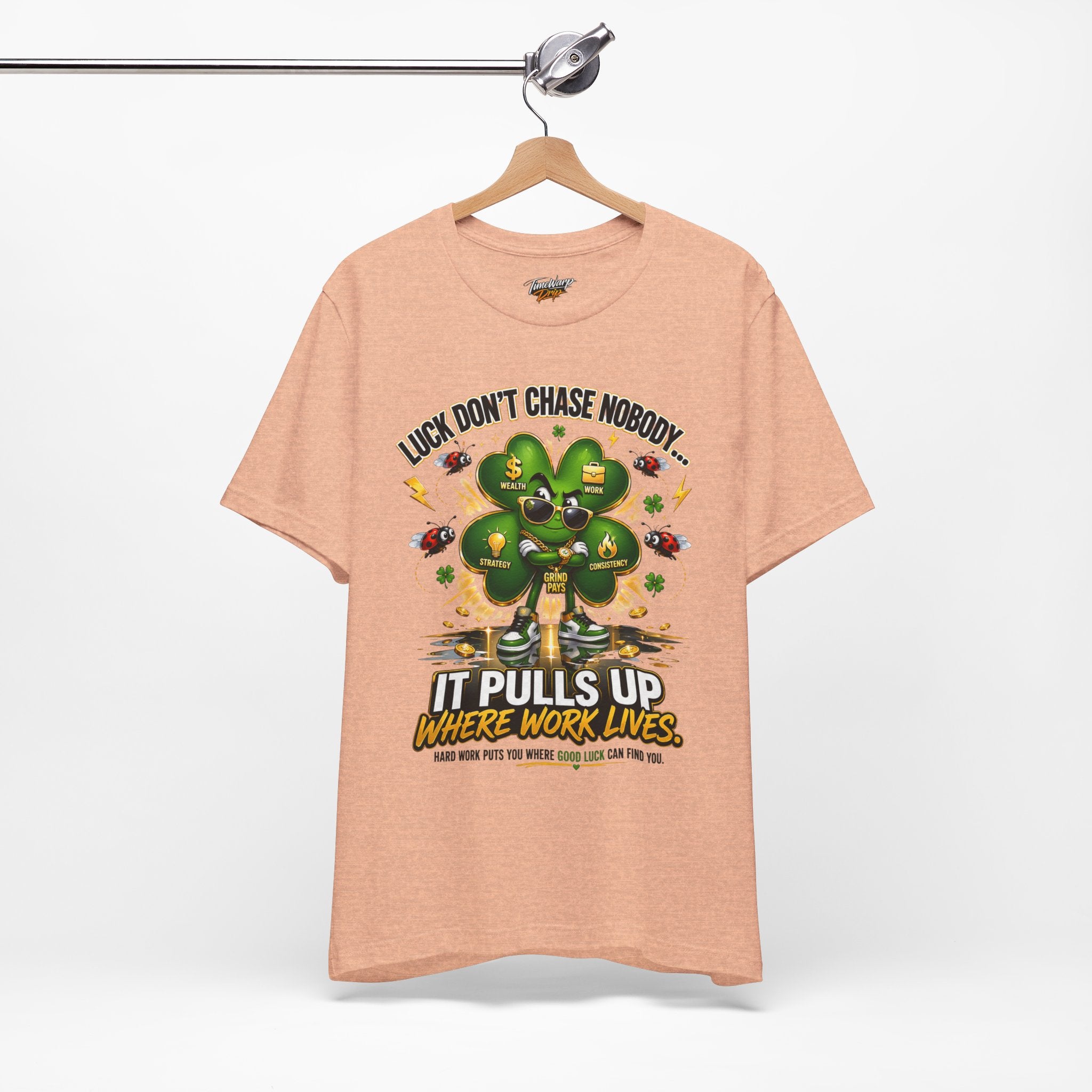 TimeWarp Drip Peach Printify tee drips with streetwise clover power—“Luck pulls up where work lives.” Airlume cotton, bold vibes only. streetwear apparel