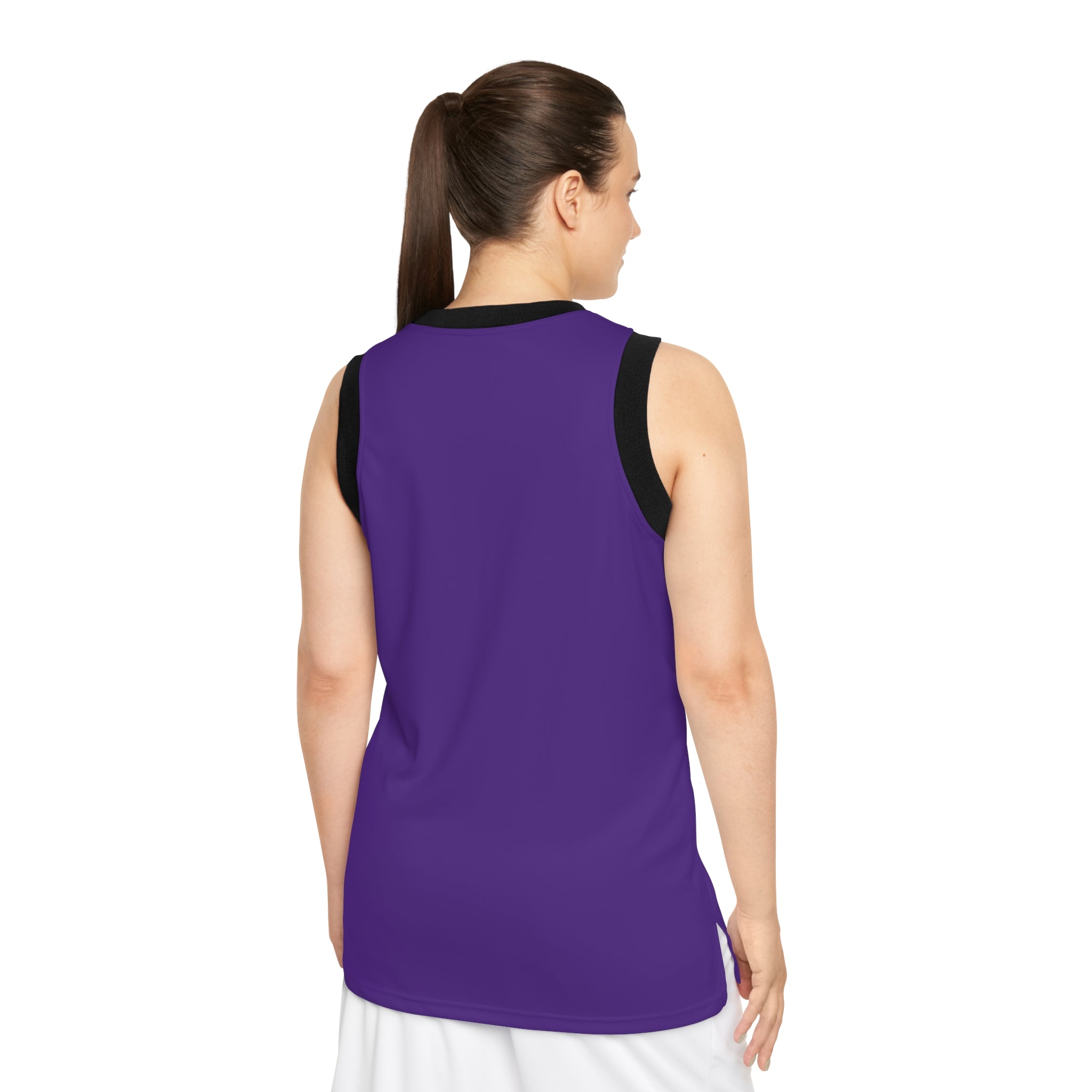 A woman with a ponytail is facing away from the camera, wearing the Court of Legends (Purple) Basketball Jersey and a white skirt.
