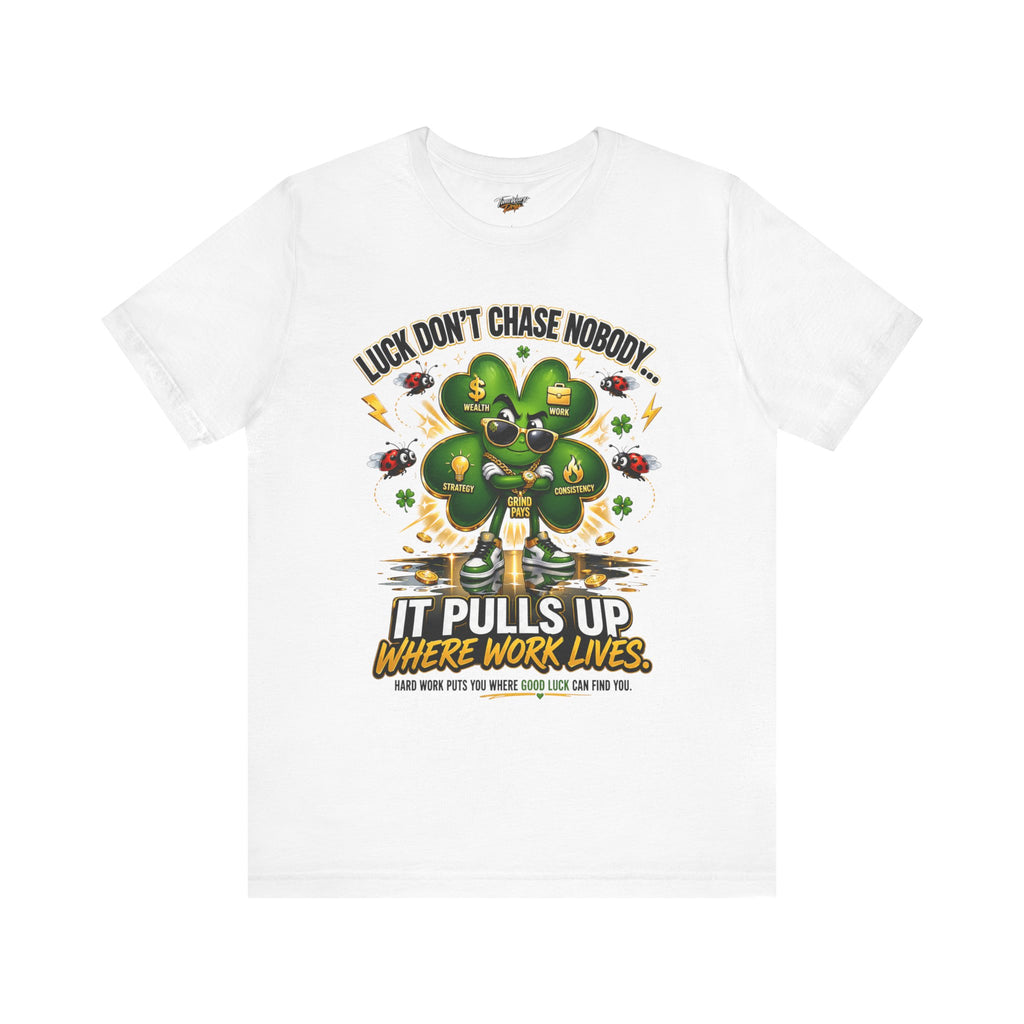 The Lucky Clover "Pulls Up Lives" Graphic T-Shirt by TimeWarp Drip features a four-leaf clover with lightning and coins, available in sizes S–3XL. The shirt reads "Luck don’t chase nobody" above and "It pulls up where work lives" below.