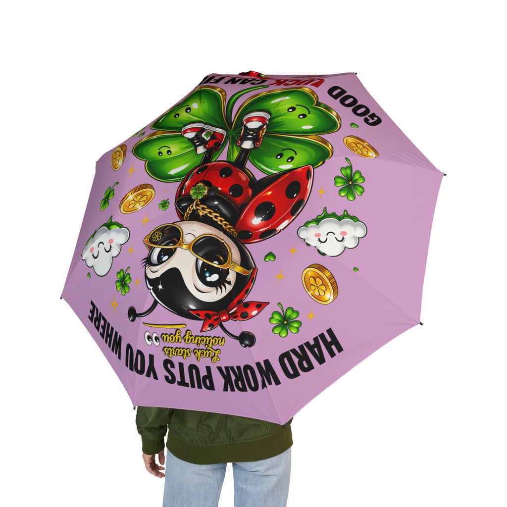 TimeWarp Drip Streetwise vibes on display—rocking a pink Printify foldable umbrella, Cute Lucky Ladybug drip, symbols and quote pop hard. streetwear apparel