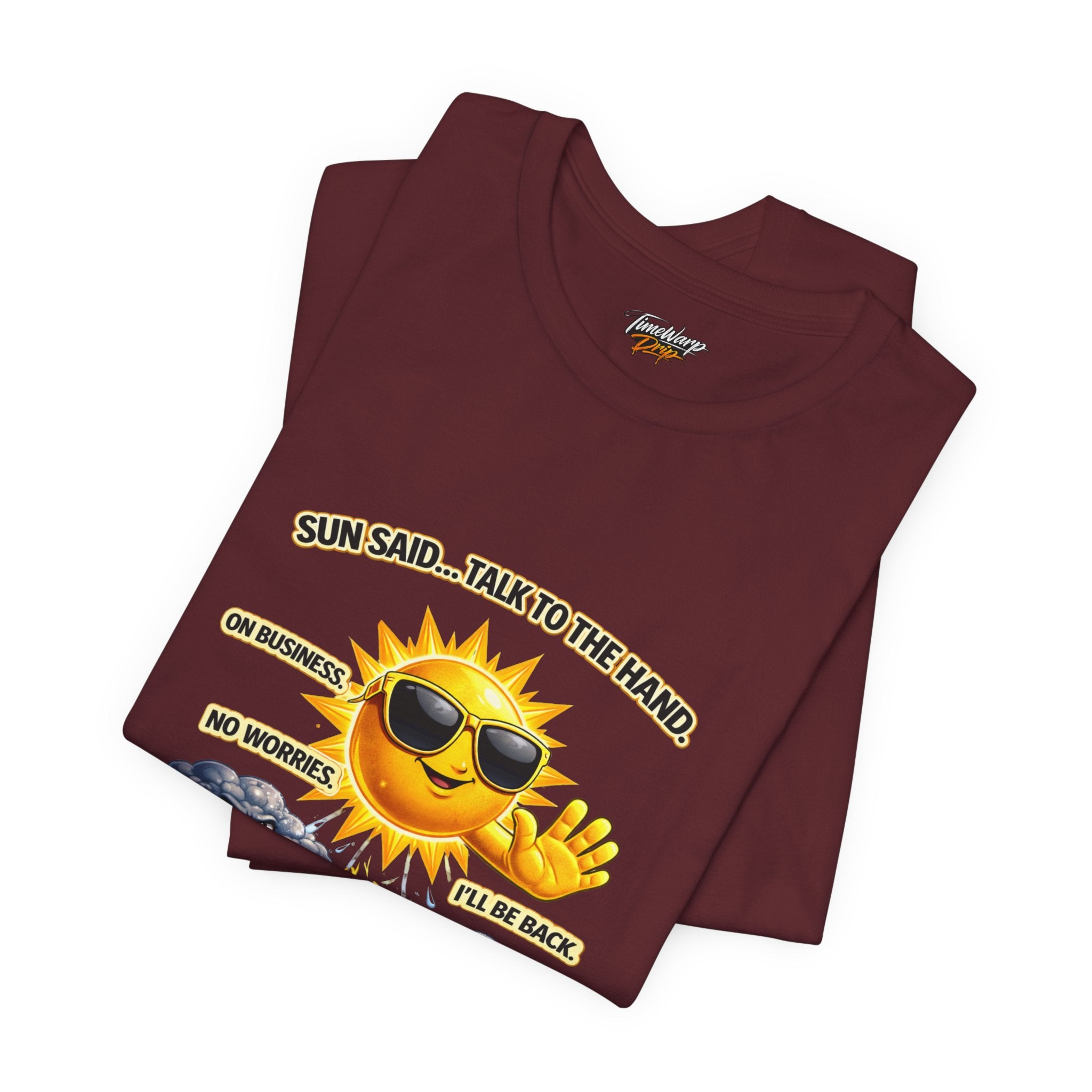 The Calm Energy Vibes T-Shirt — "I Run the Forecast" CEO Energy by TimeWarp Drip is a maroon lightweight tee with a cartoon sun wearing sunglasses and reading: SUN SAID...TALK TO THE HAND. Made from soft Airlume cotton for comfort.