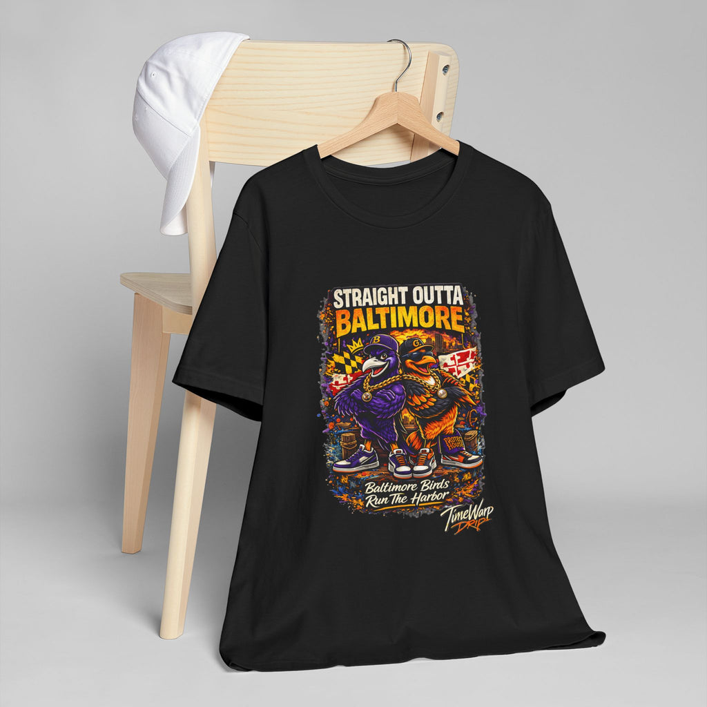 TimeWarp Drip Straight Outta Baltimore black graphic tee, street-cool on a chair, white cap flexin’ on top—bold city fan style. streetwear apparel