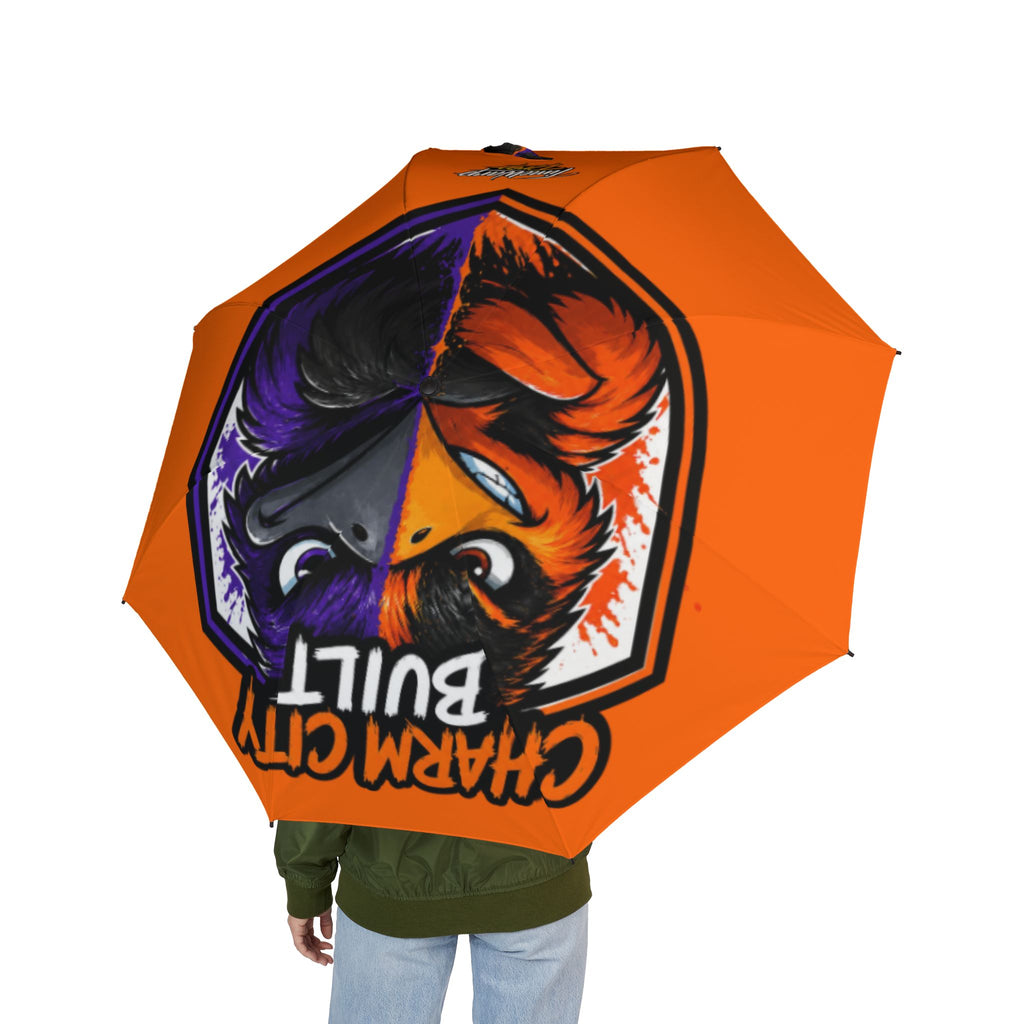 TimeWarp Drip Rock the rain with a bold orange Baltimore "Charm City Built" foldable umbrella, dripping wild animal street style.