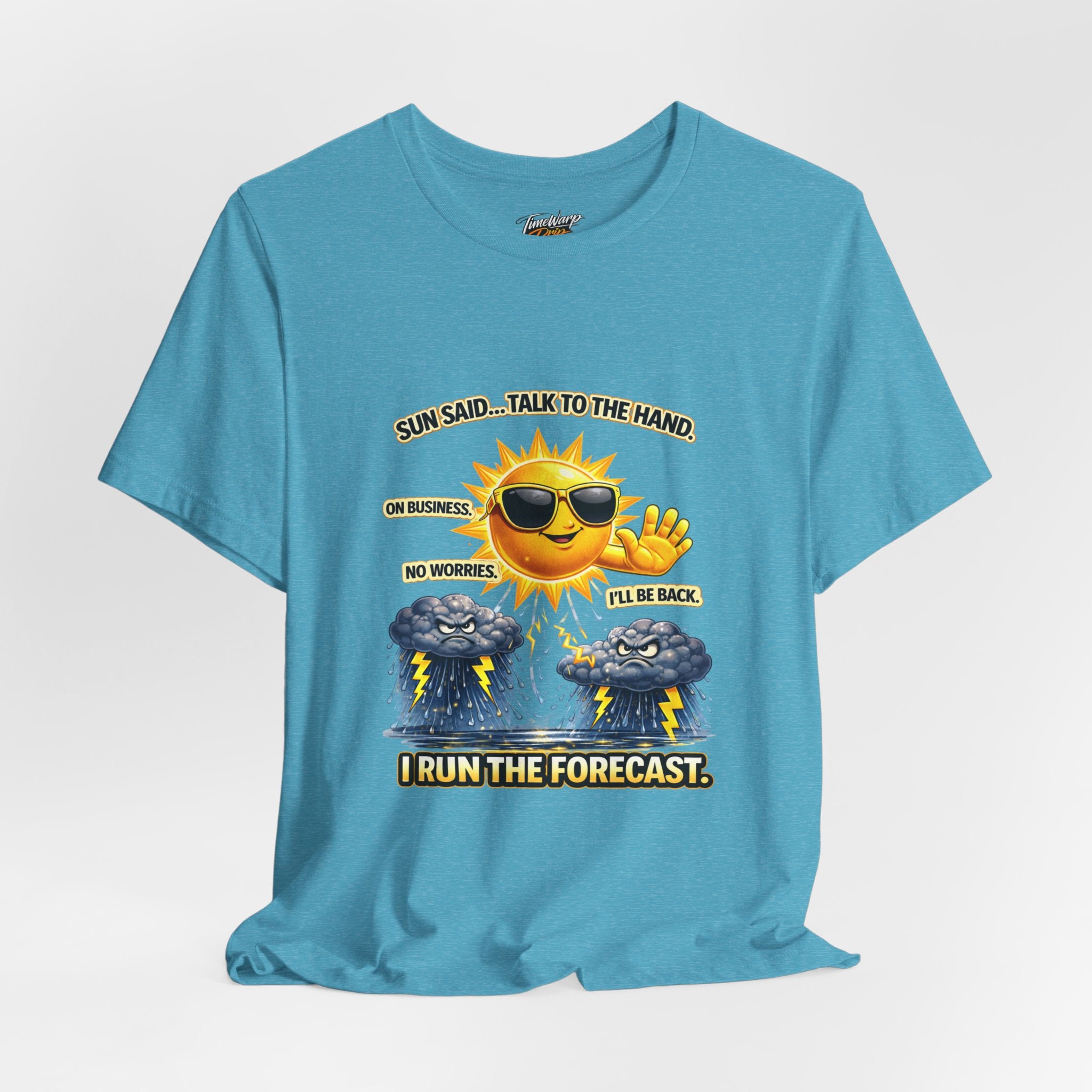 The TimeWarp Drip Calm Energy Vibes T-Shirt—"I Run the Forecast" CEO Energy—features a blue, lightweight Airlume cotton tee with a cartoon sun in shades and uplifting text: Sun said... talk to the hand. I run the forecast.