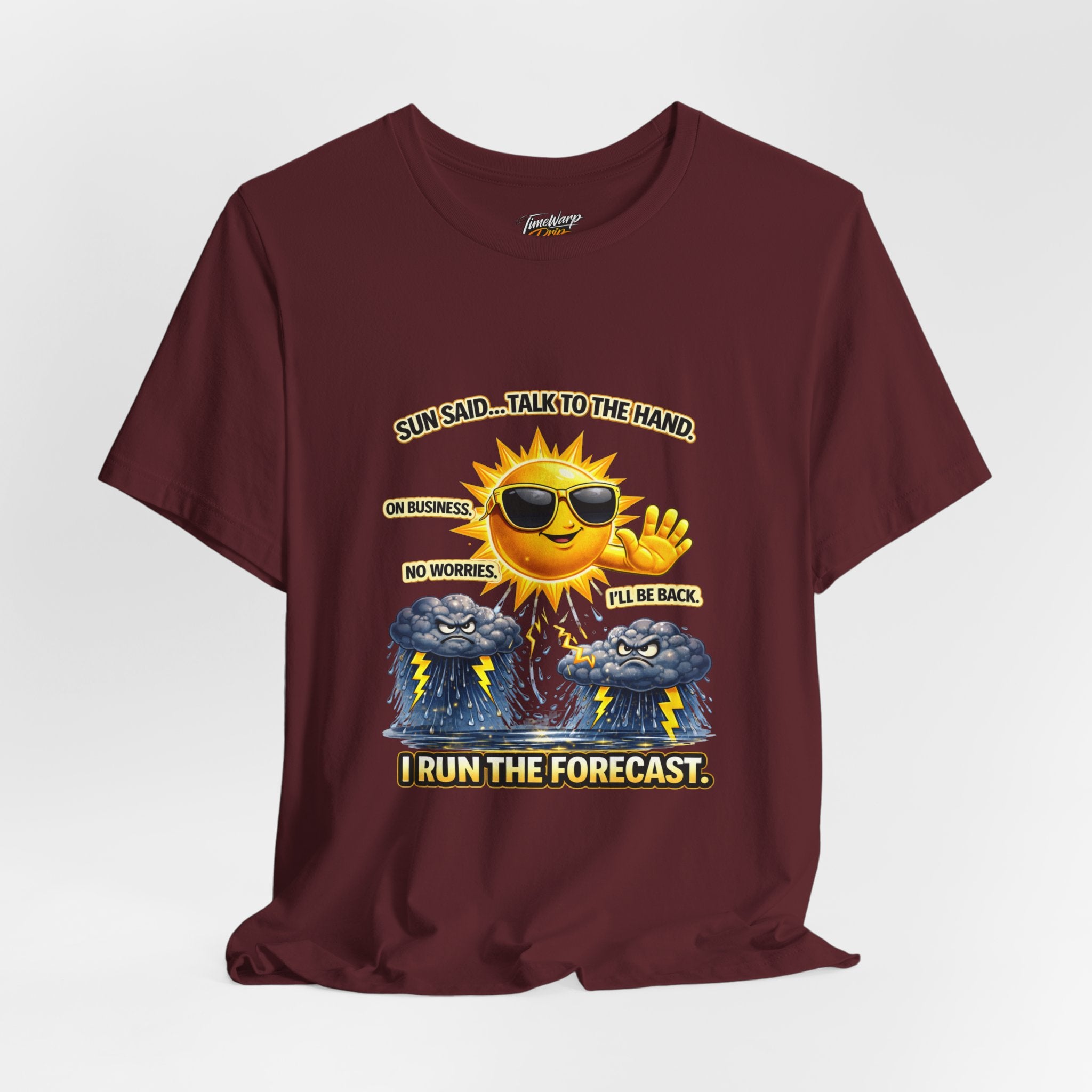 The Calm Energy Vibes T-Shirt — "I Run the Forecast" CEO Energy by TimeWarp Drip features a maroon, lightweight design with a sun in sunglasses and witty text, made from soft Airlume cotton for ultimate comfort.