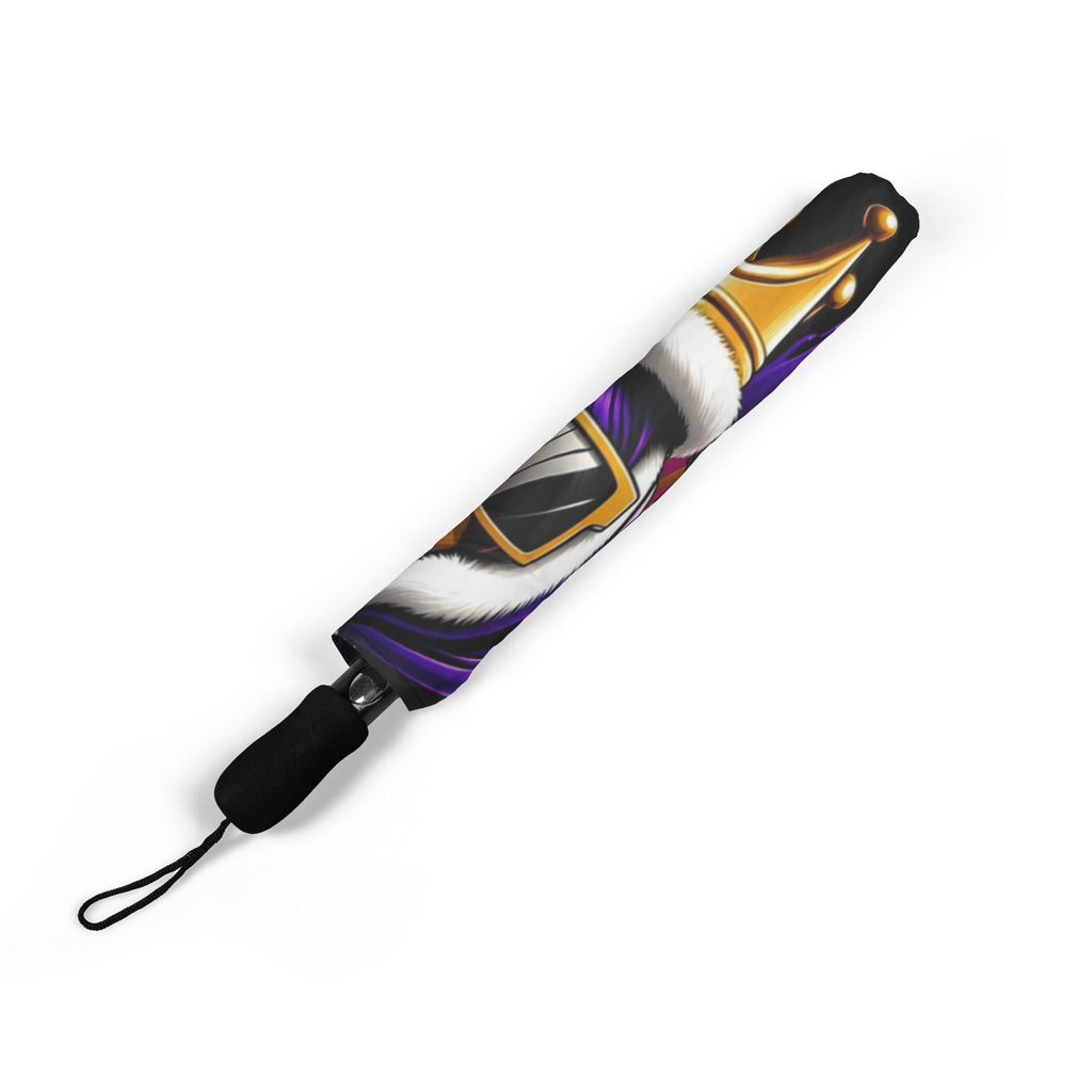The Bold "Crowned In Every Era" Design (Black) Umbrella (Semi-Automatic) features a printed gold crown with white fur on a purple background, a black handle with wrist strap, and is shown in one size against a white surface.