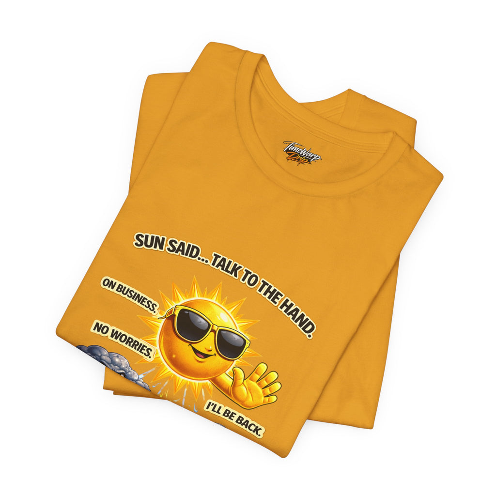 The Calm Energy Vibes T-Shirt by Printify features a yellow tee with a cartoon sun in sunglasses and the text "SUN SAID...TALK TO THE HAND. ON BUSINESS. NO WORRIES. I’LL BE BACK"—perfect for channeling CEO Energy, "I Run the Forecast.
