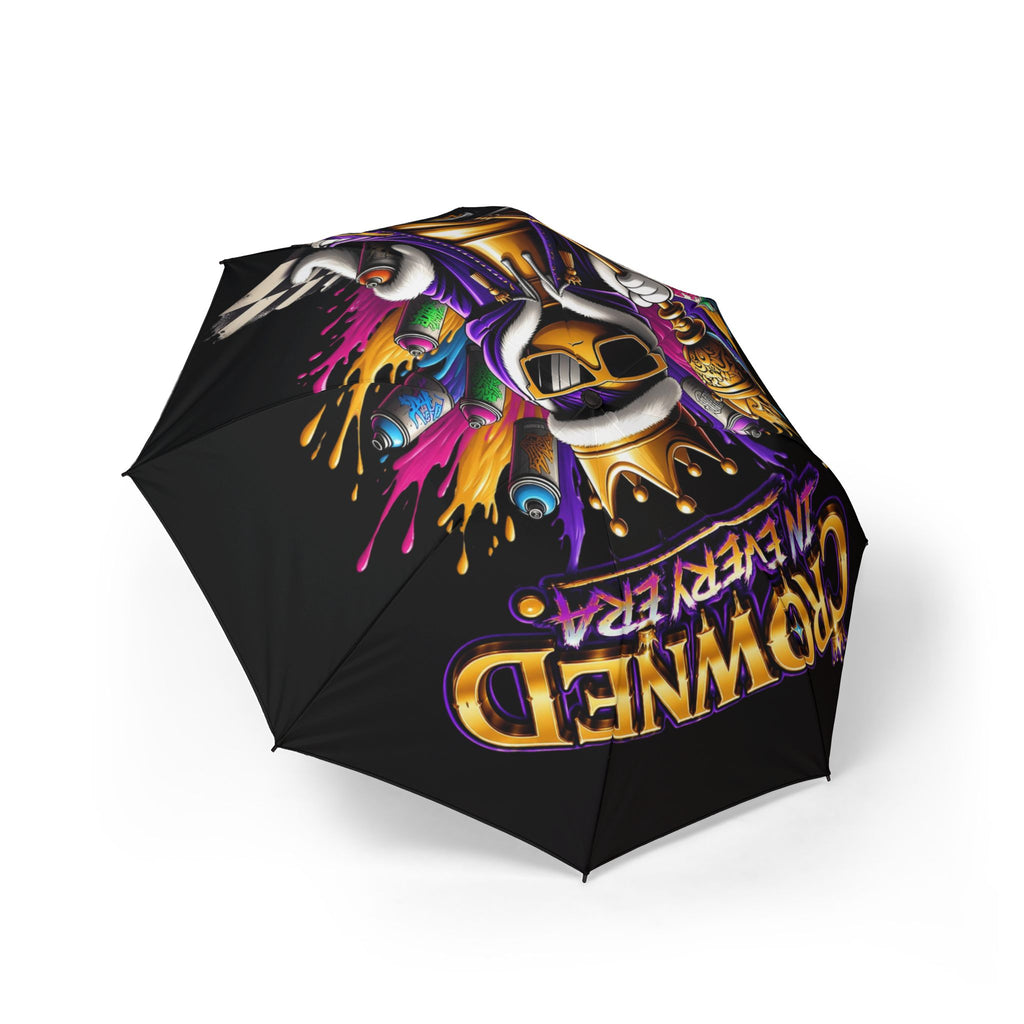 The Bold "Crowned In Every Era" Design (Black) Umbrella (Semi‑Automatic) features vibrant graffiti art with a crowned skull, headphones, colorful paint splashes, and bold lettering for a standout look.