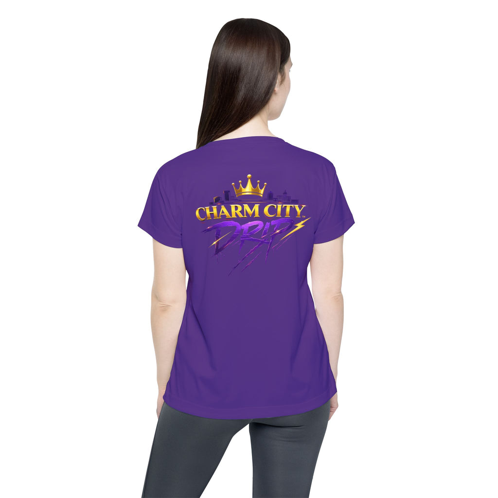 TimeWarp Drip Boss babe rocking a purple TimeWarp Drip Turf Raiders women’s jersey—division battle mode, street style from the back. streetwear apparel