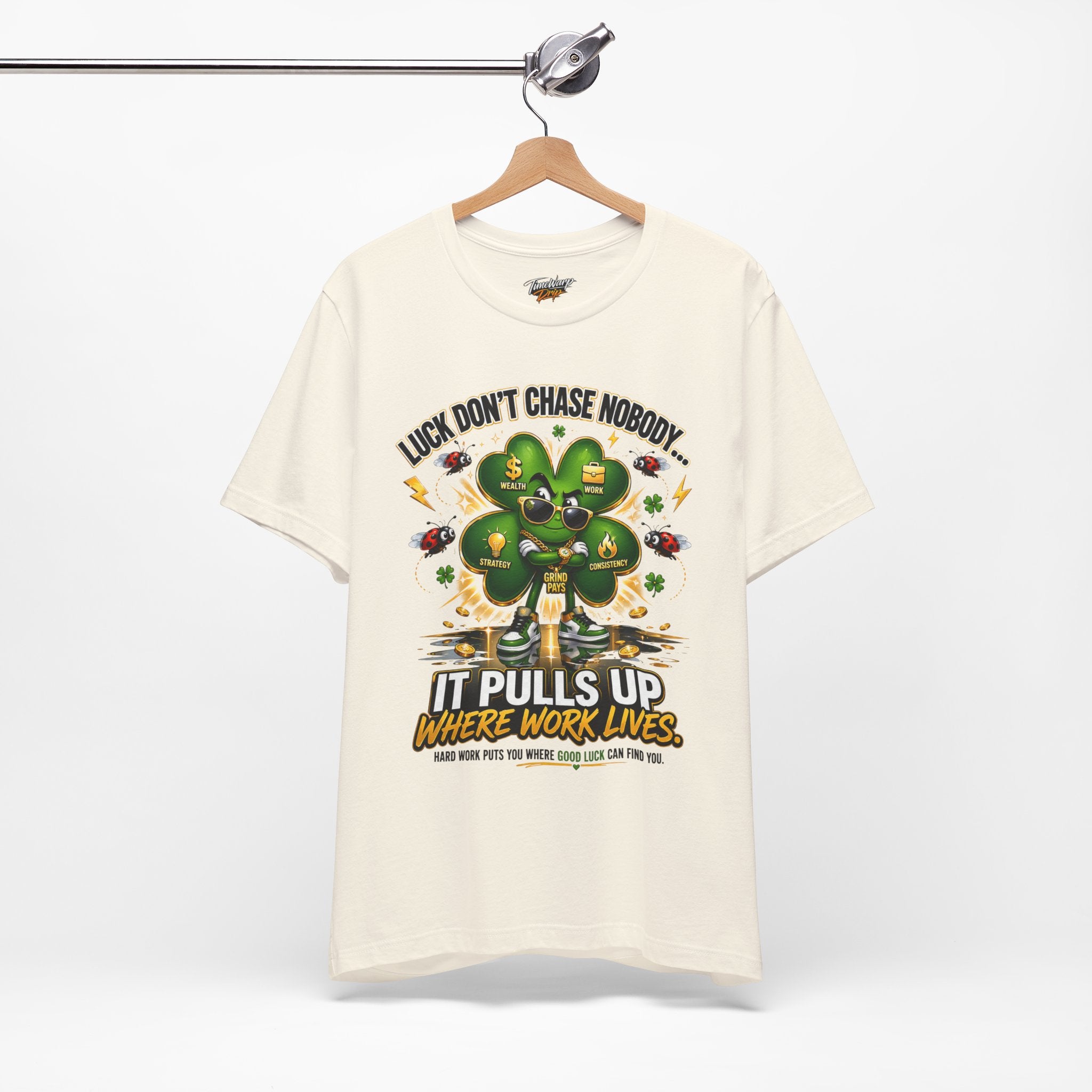 TimeWarp Drip Cream 'Luck Don't Chase Nobody' tee in soft Airlume cotton—streetwise clover graphic and bold front quote, pure drip energy. streetwear apparel
