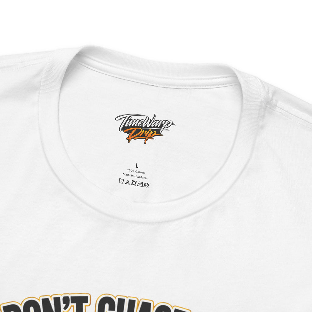 The TimeWarp Drip Lucky Clover "Pulls Up Lives" Graphic T-Shirt features a white design, care instructions inside the collar, and bold black and gold graphic text on the front. Available in sizes S, M, L, XL, 2XL, and 3XL.