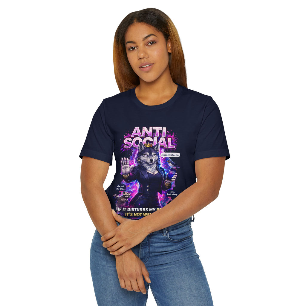 A woman in jeans and the Anti Social She-Wolf T-Shirt — a navy blue introvert graphic tee with a snarky wolf design and the text "Anti-Social" stands against a plain white background.