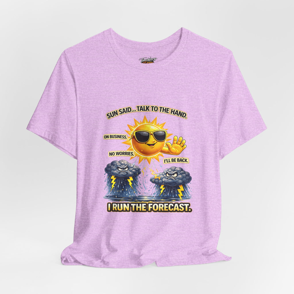 The Calm Energy Vibes T-Shirt — "I Run the Forecast" CEO Energy by TimeWarp Drip is a lightweight lavender tee with a sun in sunglasses saying, "I run the forecast," plus two storm clouds below. Made from soft Airlume cotton for all-day comfort!.