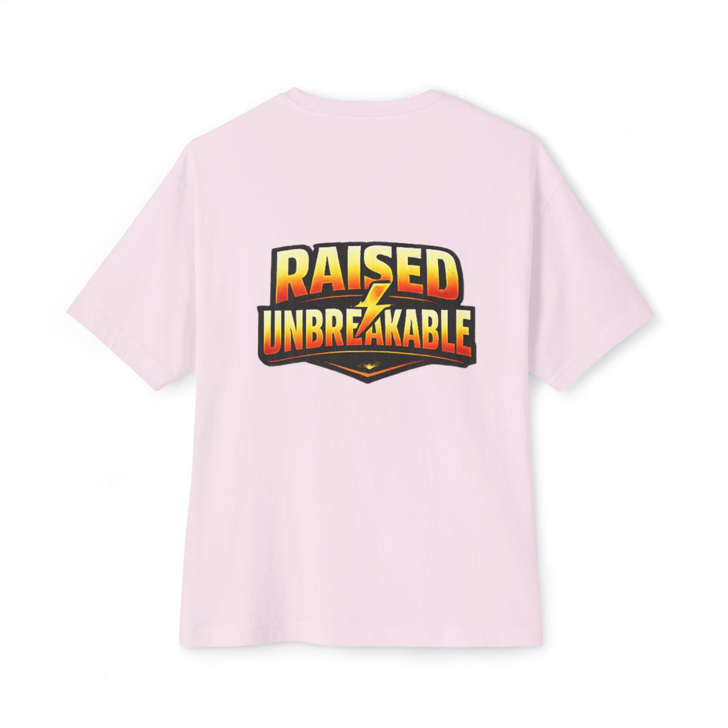 The TimeWarp Drip Generation X Parenting "Come Get Em" Tee is an oversized, boxy light pink t-shirt with a bold back graphic reading RAISED UNBREAKABLE in yellow and orange, divided by a lightning bolt—crafted from breathable cotton for comfort.
