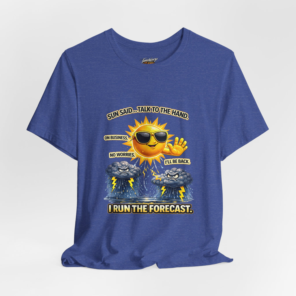 The Calm Energy Vibes T-Shirt by TimeWarp Drip shows a cartoon sun with CEO Energy raising its hand near storm clouds. "SUN SAID... TALK TO THE HAND. ON BUSINESS, NO WORRIES, I'LL BE BACK. I RUN THE FORECAST.