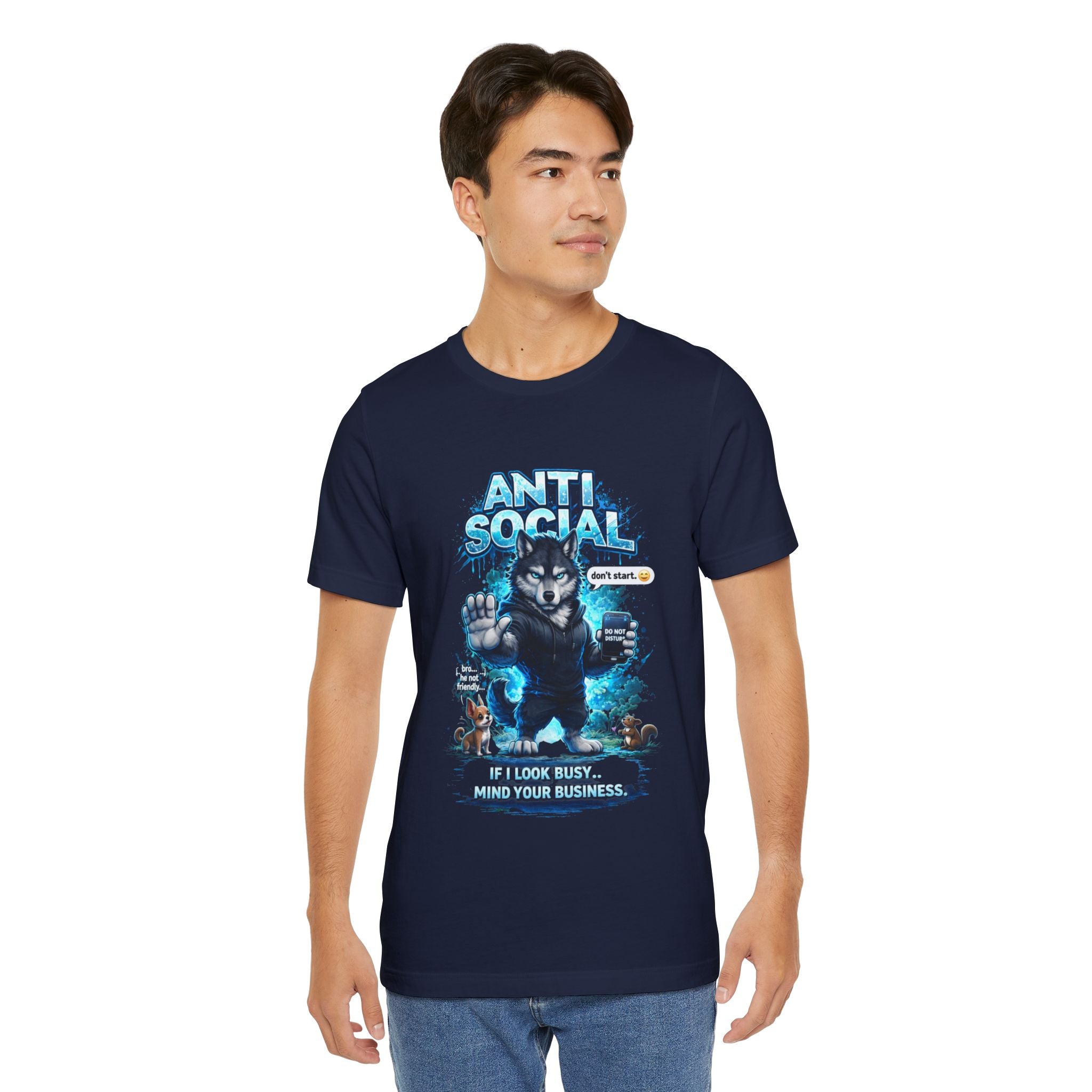A man wears the Timewarp Drip Anti Social Wolf T-Shirt, a navy blue streetwear tee featuring a wolf graphic and the phrases "ANTI SOCIAL" and "If I look busy... mind your business," channeling that classic grumpy wolf shirt vibe.