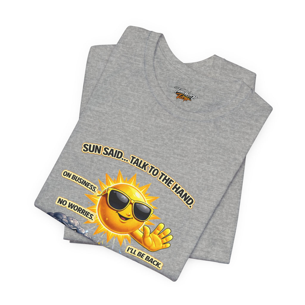 The Calm Energy Vibes T-Shirt by Printify—"I Run the Forecast" CEO Energy—features a folded gray tee with a cartoon sun in sunglasses, holding up a hand, and radiates boss vibes with its witty CEO-inspired message.