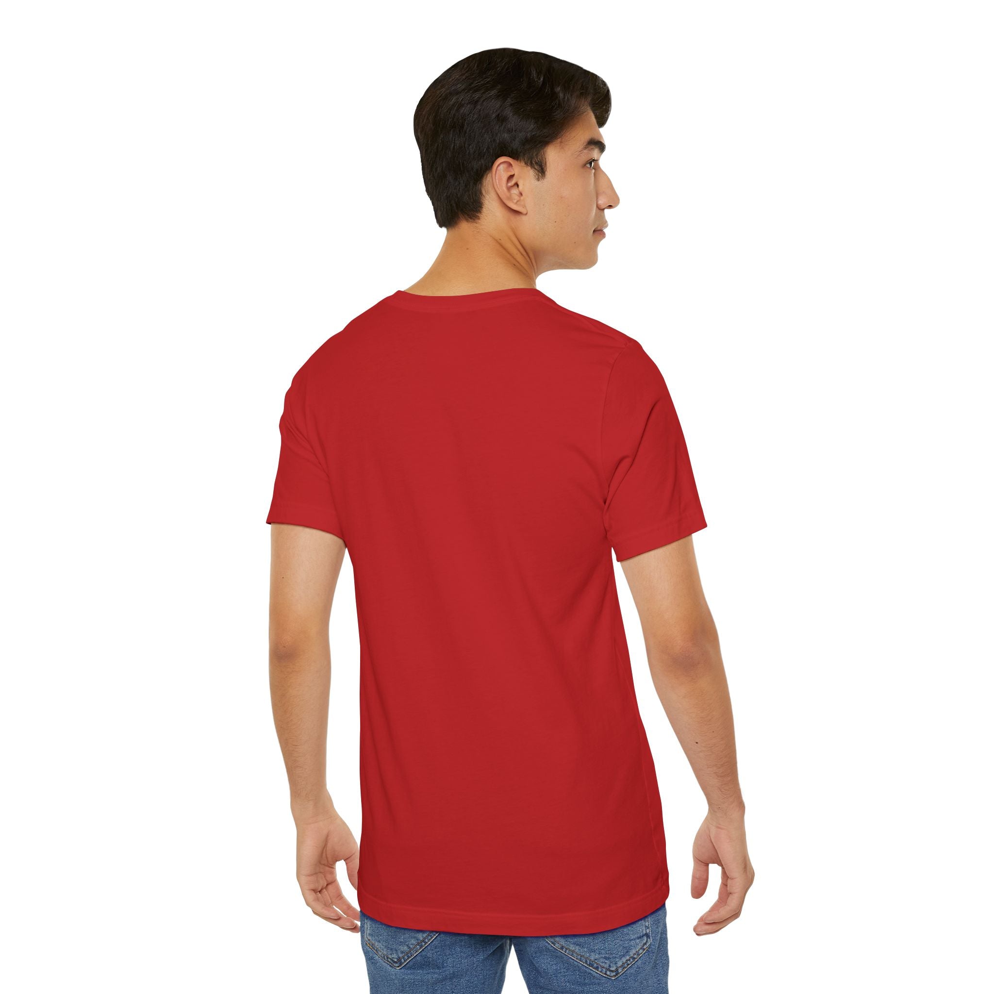 A young man in blue jeans wears the Anti Social Shark T-Shirt — Funny Introvert Graphic Tee, standing with his back to the camera and looking over his left shoulder against a white background.