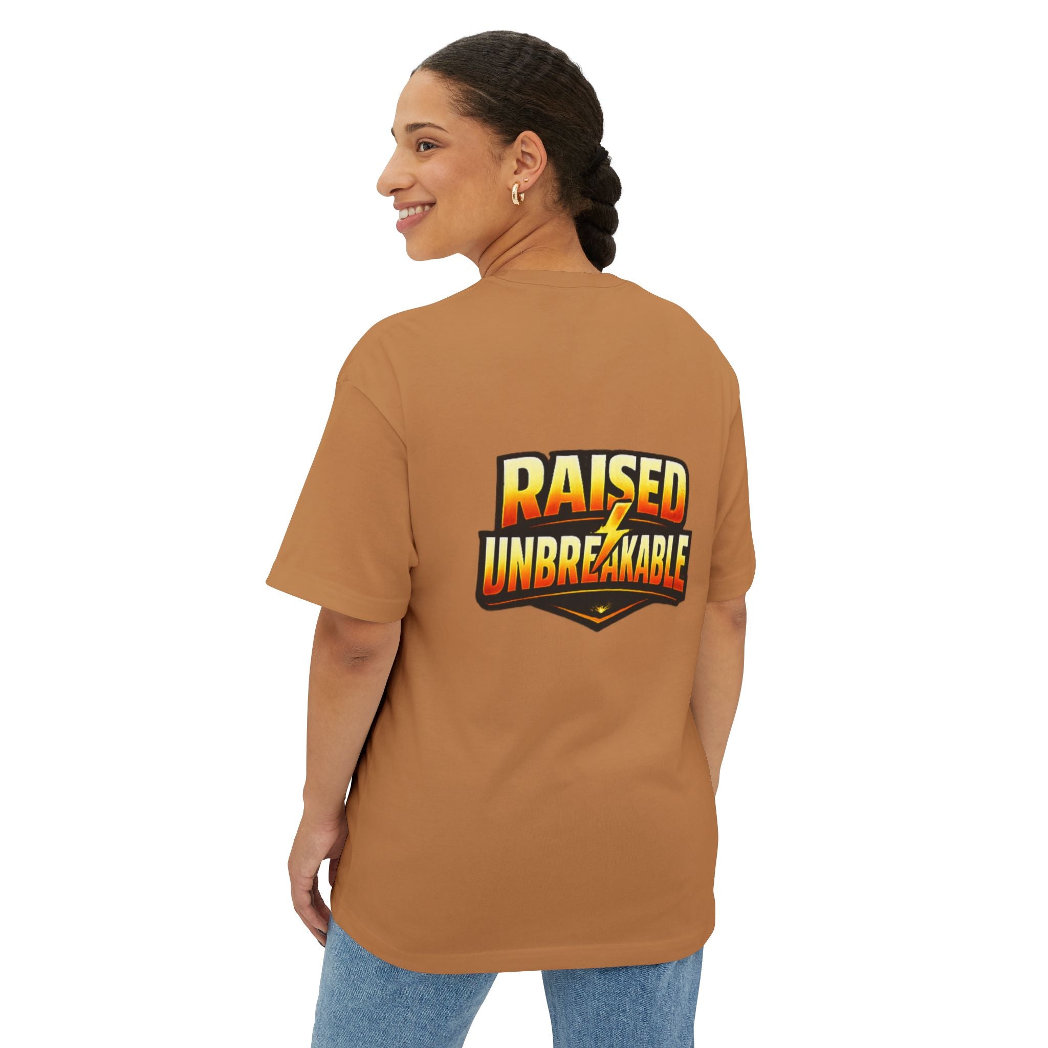 A woman with braided hair smiles in the Generation X Parenting "Come Get Em" Oversized Boxy T-Shirt from TimeWarp Drip, made of breathable cotton and featuring bold colorful text on the back—ideal for Gen X parenting style.