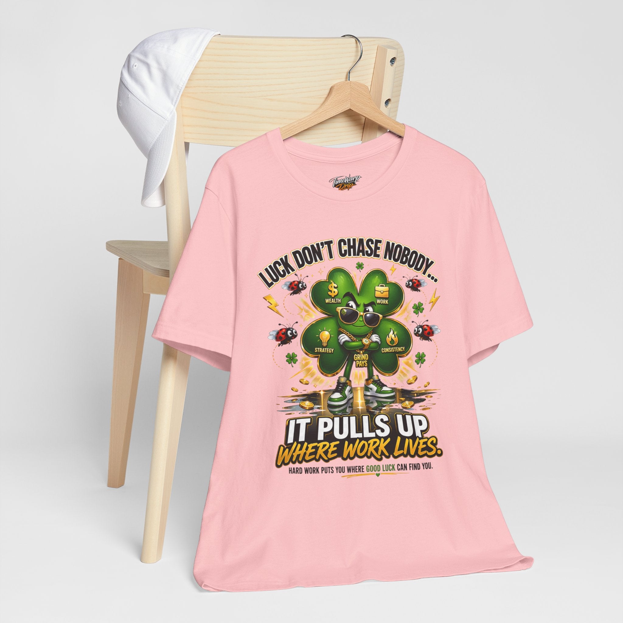 TimeWarp Drip Printify’s bold black "Luck Don't Chase Nobody" 4-Leaf Clover Tee drips on a chair, white cap flexing cool vibes on the back. streetwear apparel