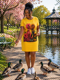 TimeWarp Drip Boss lady rocks a bold sunflower TimeWarp Drip T-shirt dress, rocking street style as she feeds ducks near spring blooms and a gazebo. streetwear apparel