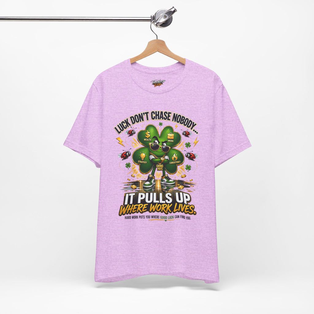TimeWarp Drip Printify Luck Don’t Chase Nobody 4-Leaf Clover T-Shirt in bold lavender; streetwise text and clover pop graphic, pure drip style. streetwear apparel
