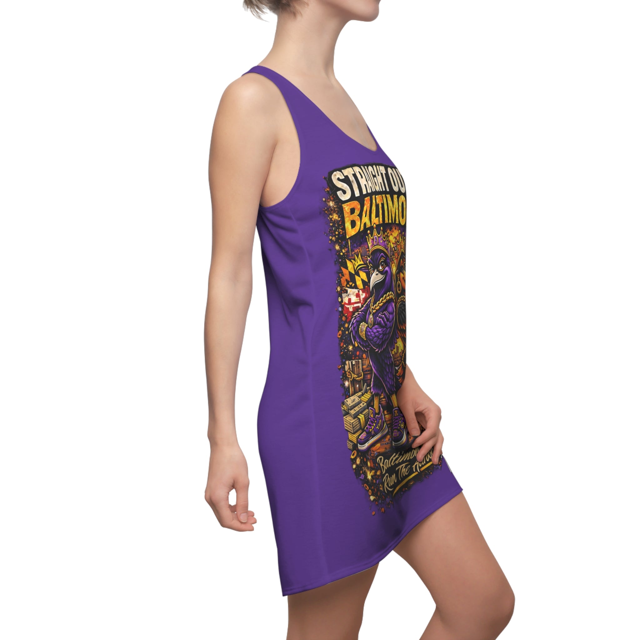 A woman wears the Printify Purple Racerback Dress—Straight Outta Baltimore—showcasing "Charm City Attitude" with a vibrant cartoon raven and city graphics.