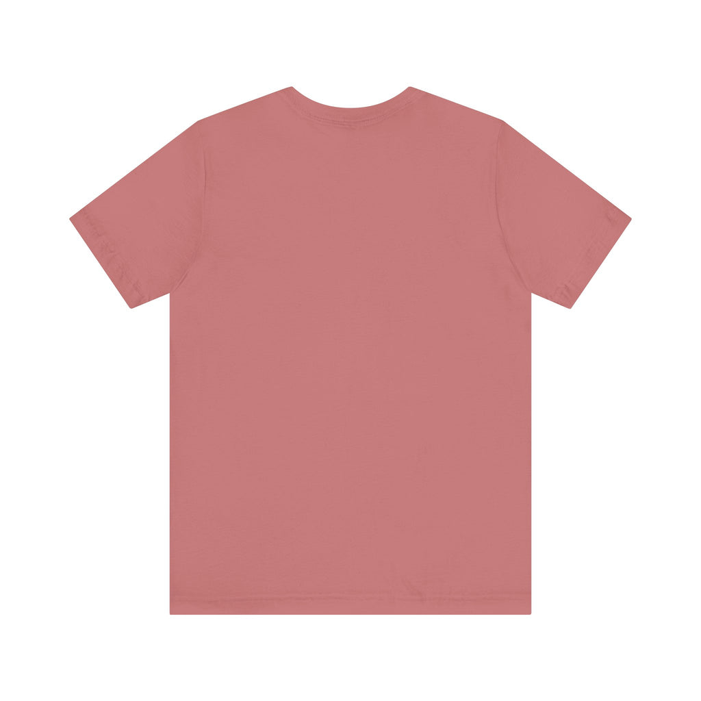 The Lucky Clover "Pulls Up Lives" Graphic T-Shirt by TimeWarp Drip is shown flat, back side up, in muted pink. Available in sizes S–3XL.