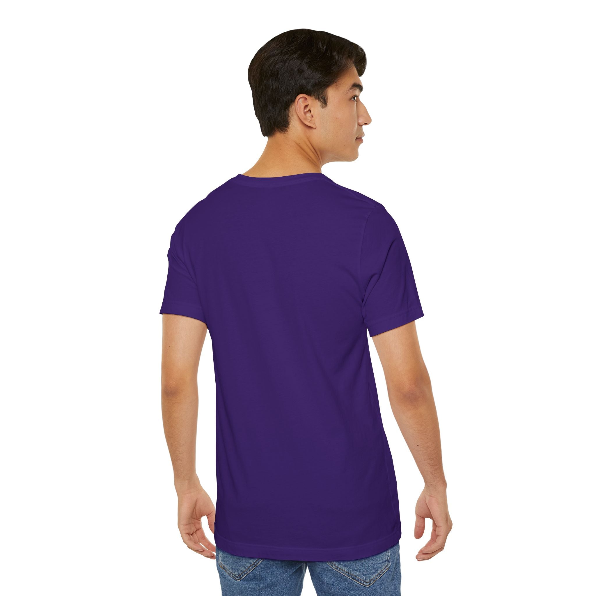 A young man wearing Timewarp Drip’s Anti Social Wolf T-Shirt — a funny introvert graphic tee — and blue jeans stands facing away, his left arm bent as he glances over his left shoulder.