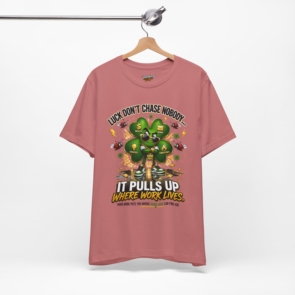 TimeWarp Drip Pink Printify tee with bold "Luck Don’t Chase Nobody" slogan, 4-leaf clover, cash icons—streetwear drip, instant vibe. streetwear apparel