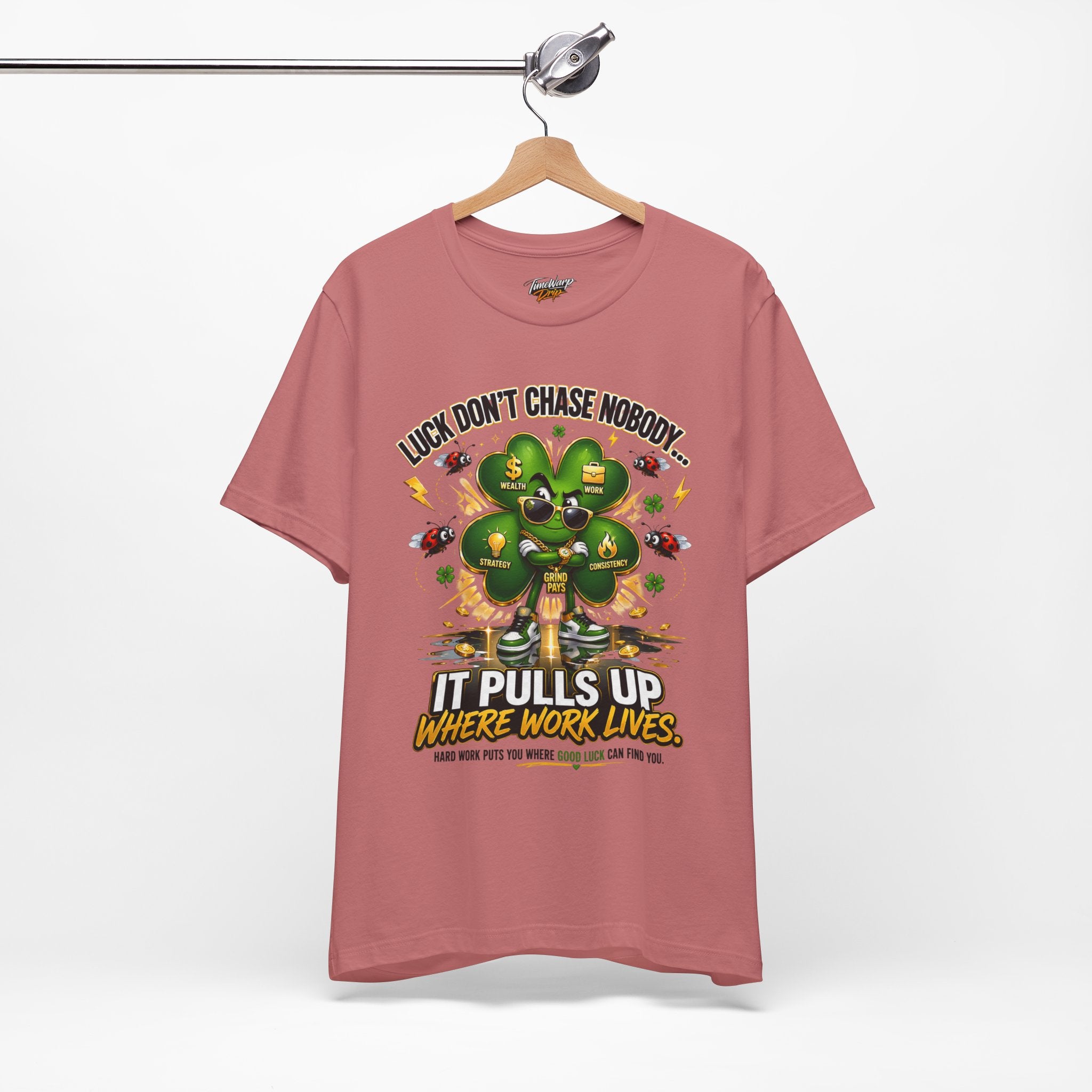 TimeWarp Drip Pink Printify tee with bold "Luck Don’t Chase Nobody" slogan, 4-leaf clover, cash icons—streetwear drip, instant vibe. streetwear apparel