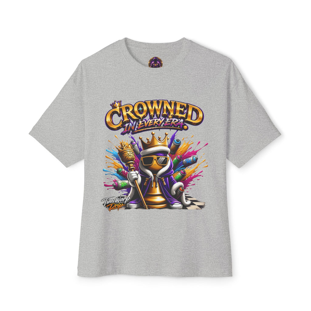 The Crowned In Every Era - Unisex Oversized Boxy Tee is a gray, relaxed fit shirt made of 100% airlume cotton. Features a cartoon king chess piece with sunglasses, crown, and scepter amid colorful splashes and the text "CROWNED IN EVERY ERA.