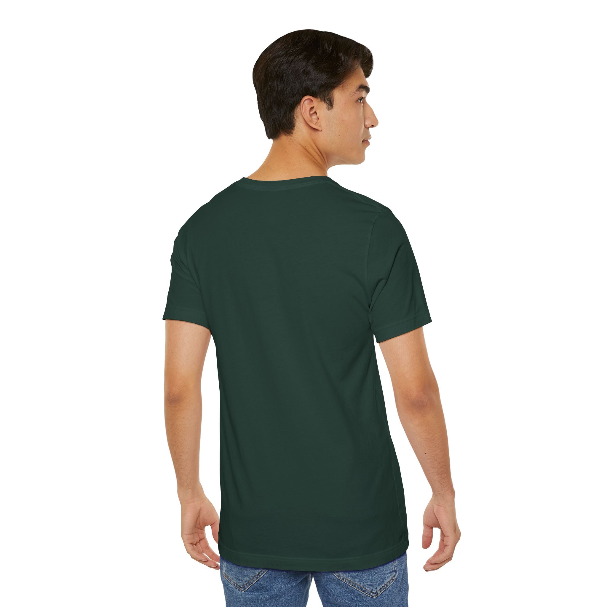A young man with short dark hair is standing against a plain white background, facing away from the camera and looking slightly right. He’s wearing blue jeans and an Anti Social Shark T-Shirt — Funny Introvert Graphic Tee.