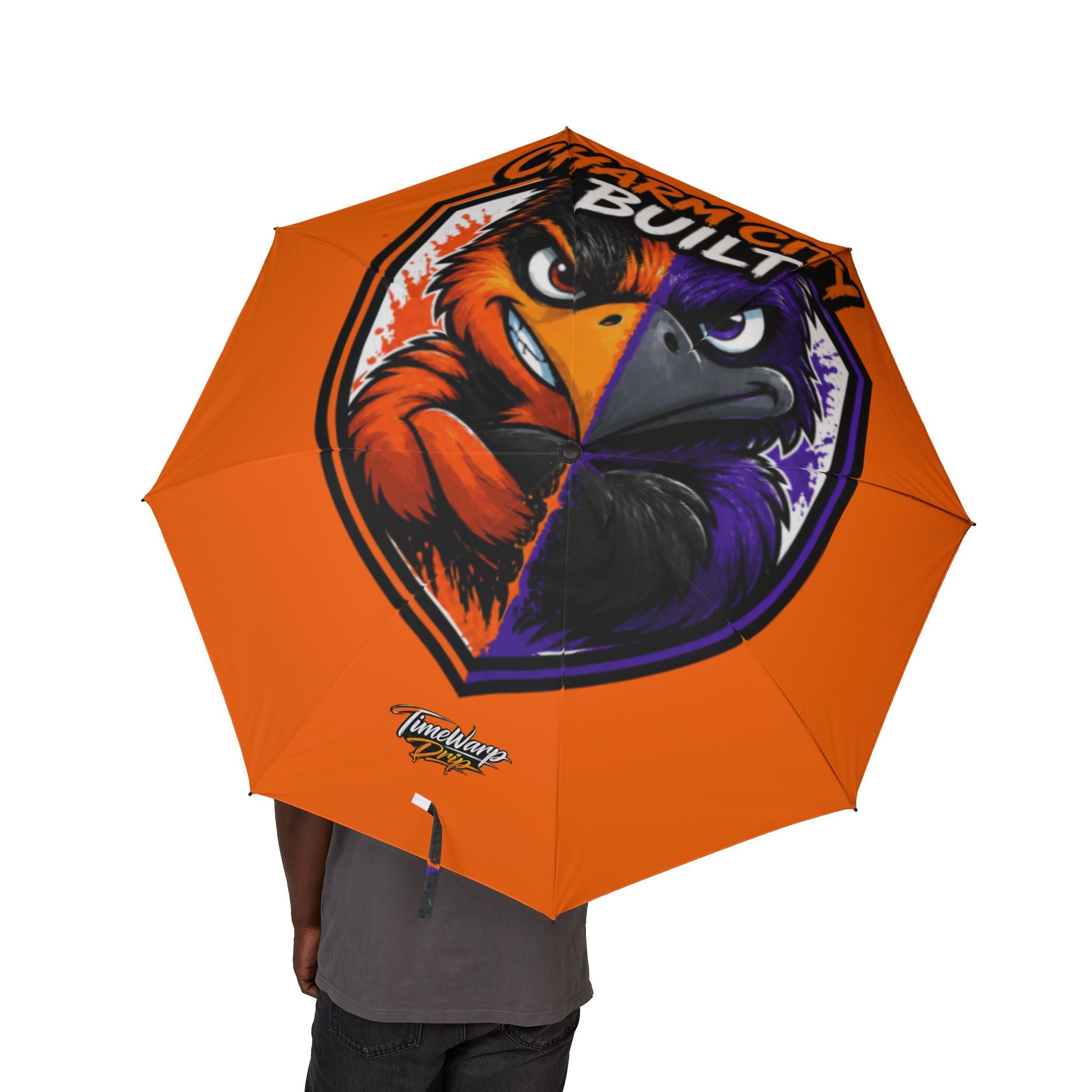 TimeWarp Drip Rockin’ a bold orange foldable sports umbrella—Baltimore “Charm City Built” drip, cartoon bird face in full streetwear flair. 