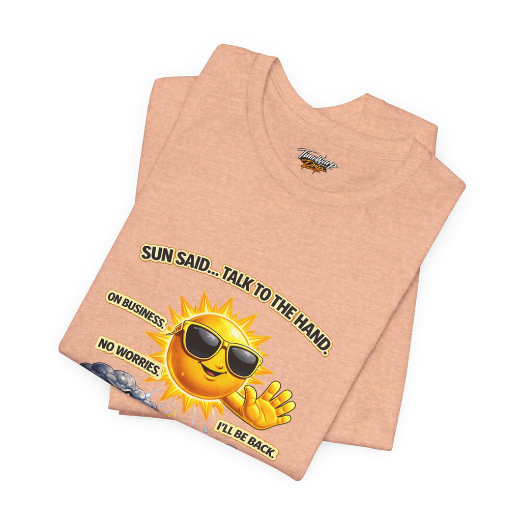 The Calm Energy Vibes T-Shirt from Printify features a peach shade, lightweight design, and a smiling sun graphic with sunglasses. It reads “I Run the Forecast,” perfect for CEO Energy vibes.