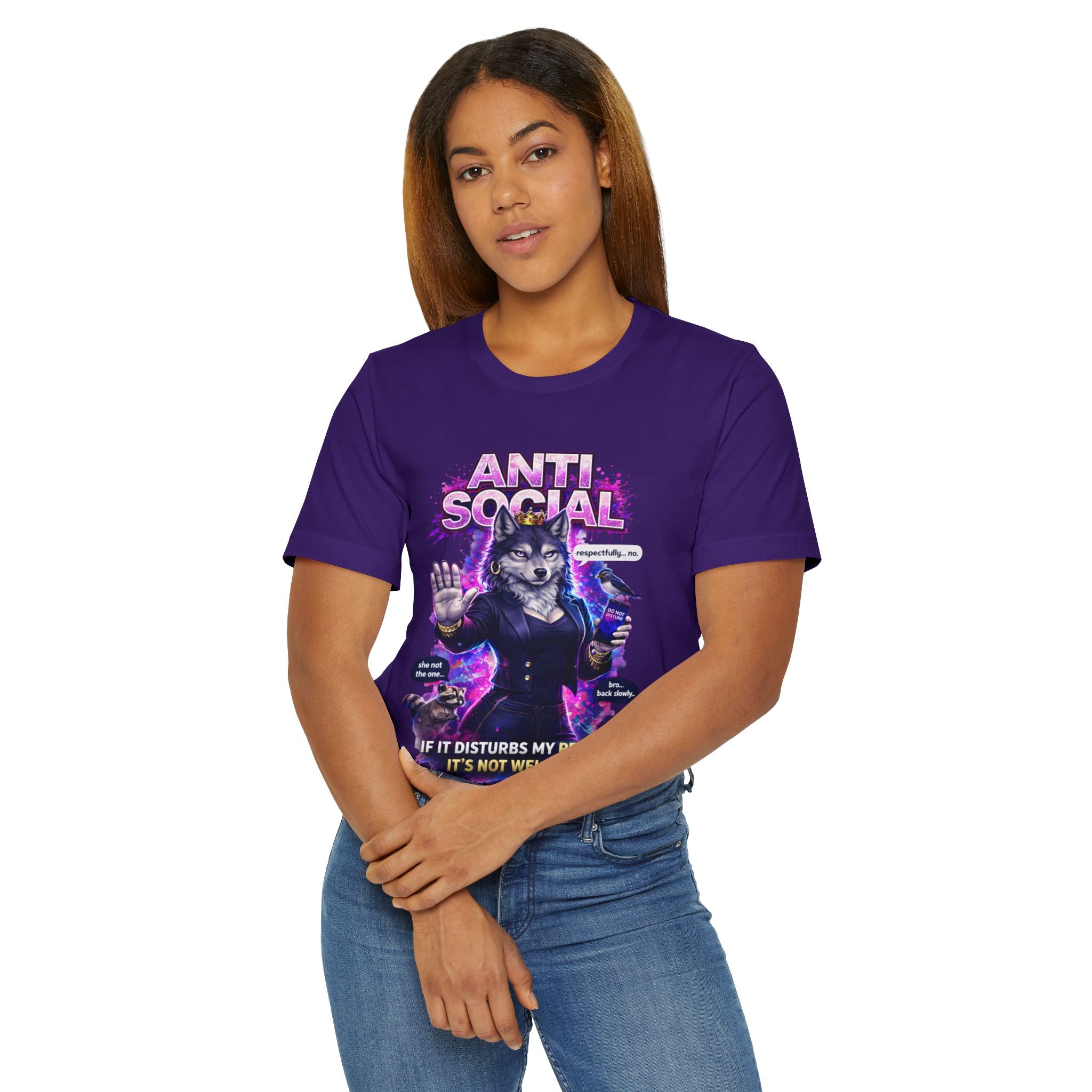 A woman with long brown hair wears the Anti Social She-Wolf T-Shirt— a funny introvert graphic tee—standing with her hands clasped in front of her against a white background.