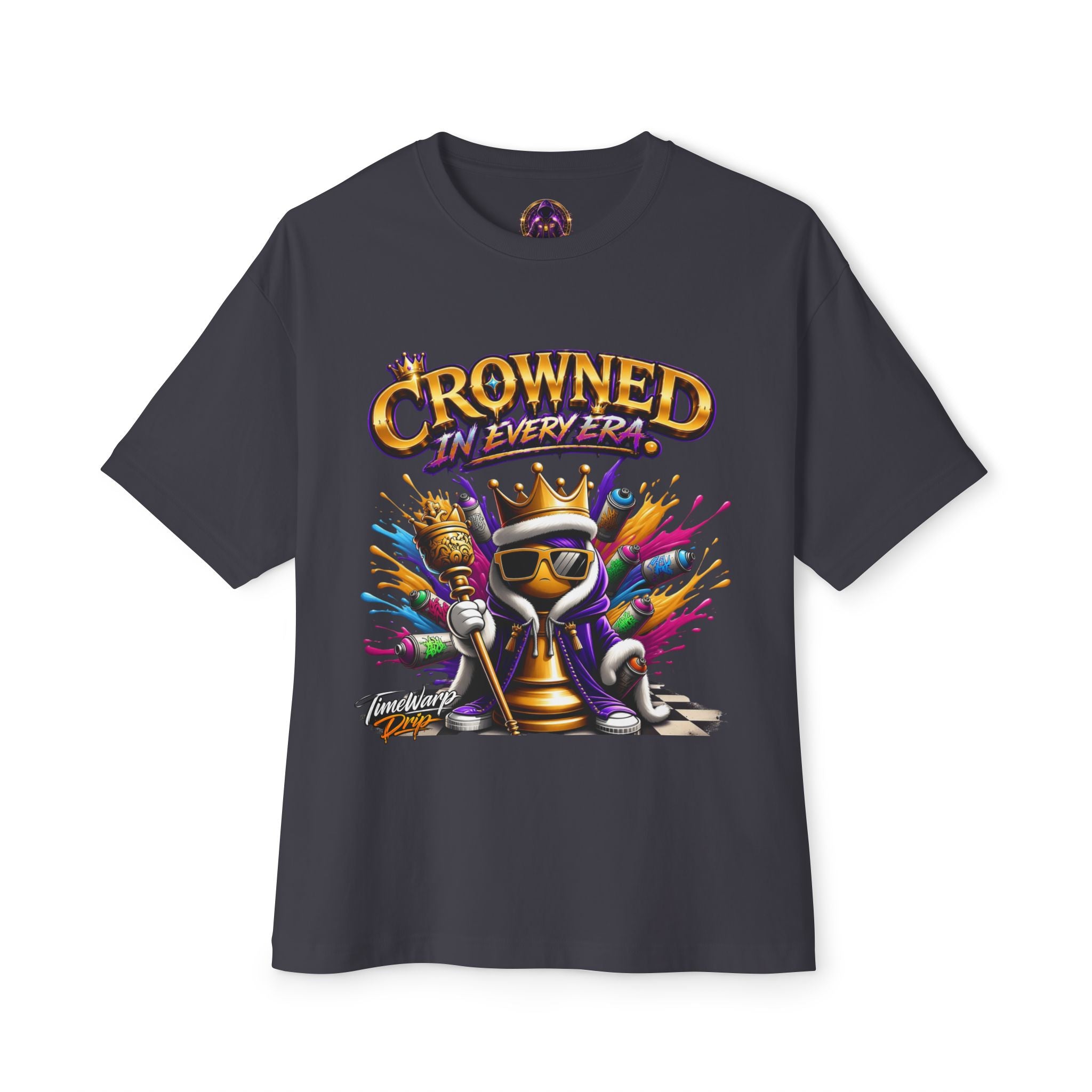 The Crowned In Every Era - Unisex Oversized Boxy Tee is a black 100% airlume cotton shirt with a relaxed fit, showcasing a crowned chess king in sunglasses holding a scepter and the "CROWNED IN EVERY ERA" text with colorful splashes behind.