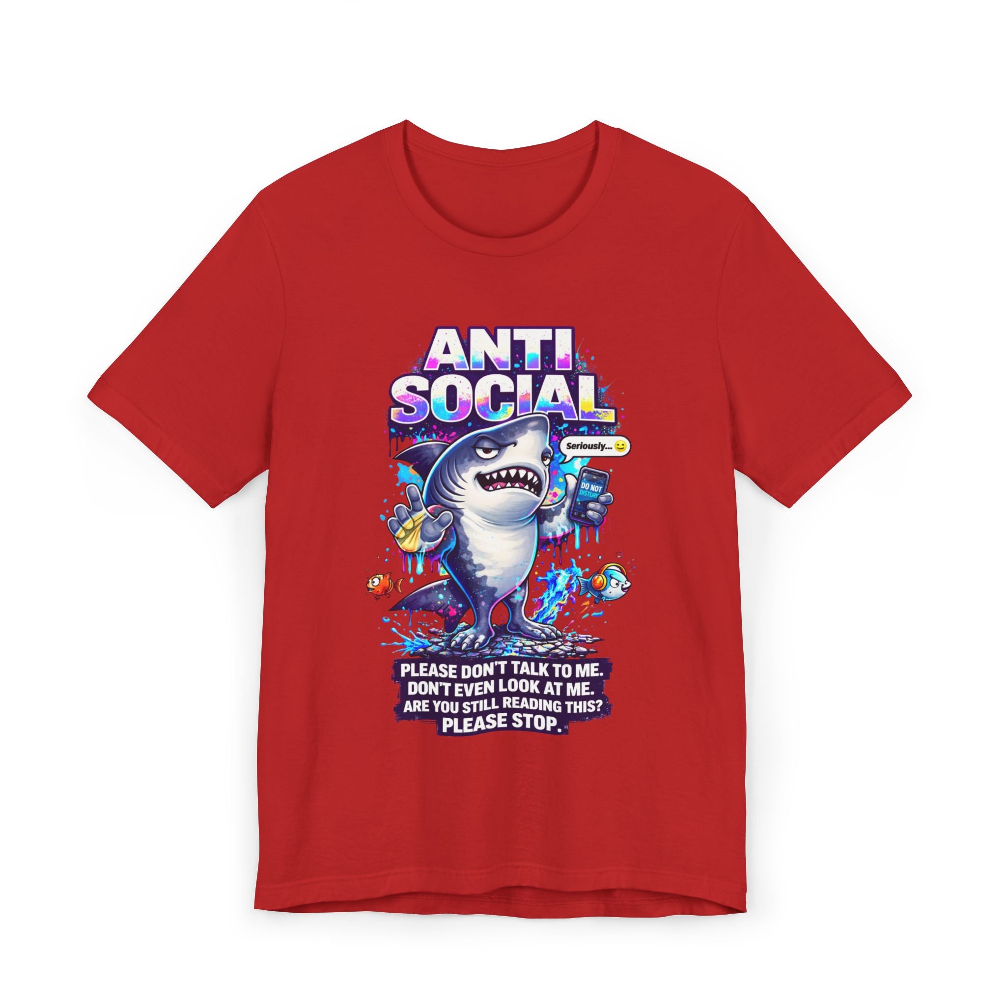 The Anti Social Shark T-Shirt — Funny Introvert Graphic Tee is a red unisex cotton shirt with a cartoon shark holding a phone, surrounded by fish. Text reads: ANTI SOCIAL and Please don’t talk to me. Don’t even look at me. Please stop reading this.