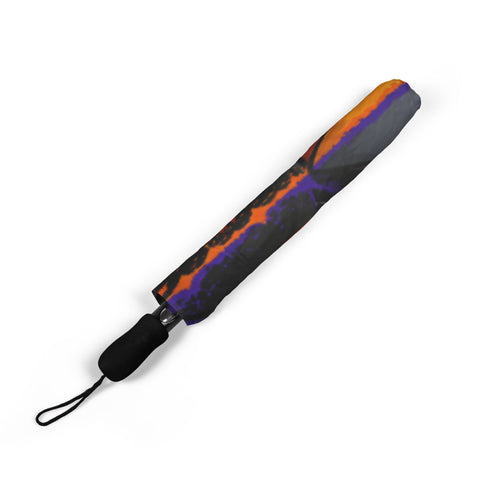 TimeWarp Drip "Charm City Built" foldable umbrella, black handle, orange-purple drip pattern. Street-ready Baltimore style—unfold the vibe!. 