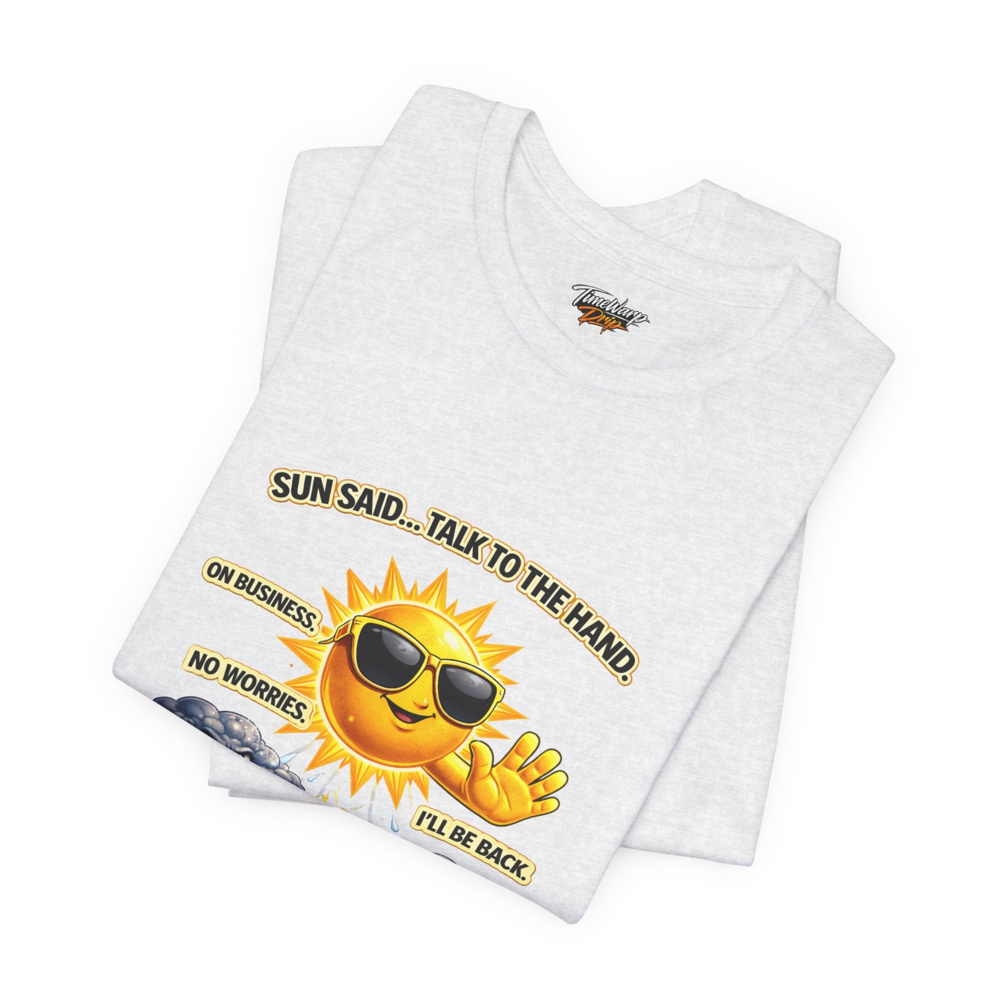 The Calm Energy Vibes T-Shirt — "I Run the Forecast" by Printify is a white Airlume cotton tee featuring a cartoon sun in shades, hand raised. Text: SUN SAID... TALK TO THE HAND. ON BUSINESS. NO WORRIES I’LL BE BACK. Ace those CEO Energy days!.