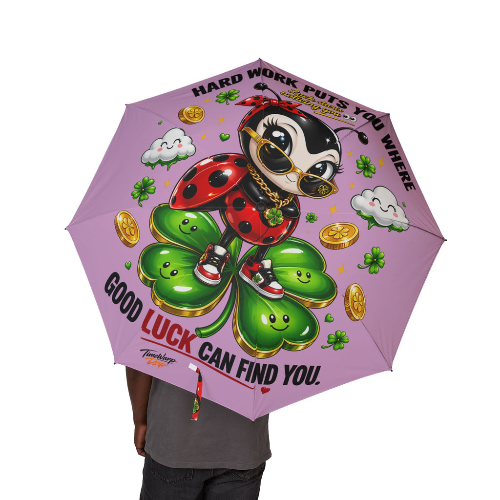 TimeWarp Drip Rocking the Printify pink foldable umbrella—lucky ladybug vibes, coins, clovers, and bold motivational drip on the go!. streetwear apparel