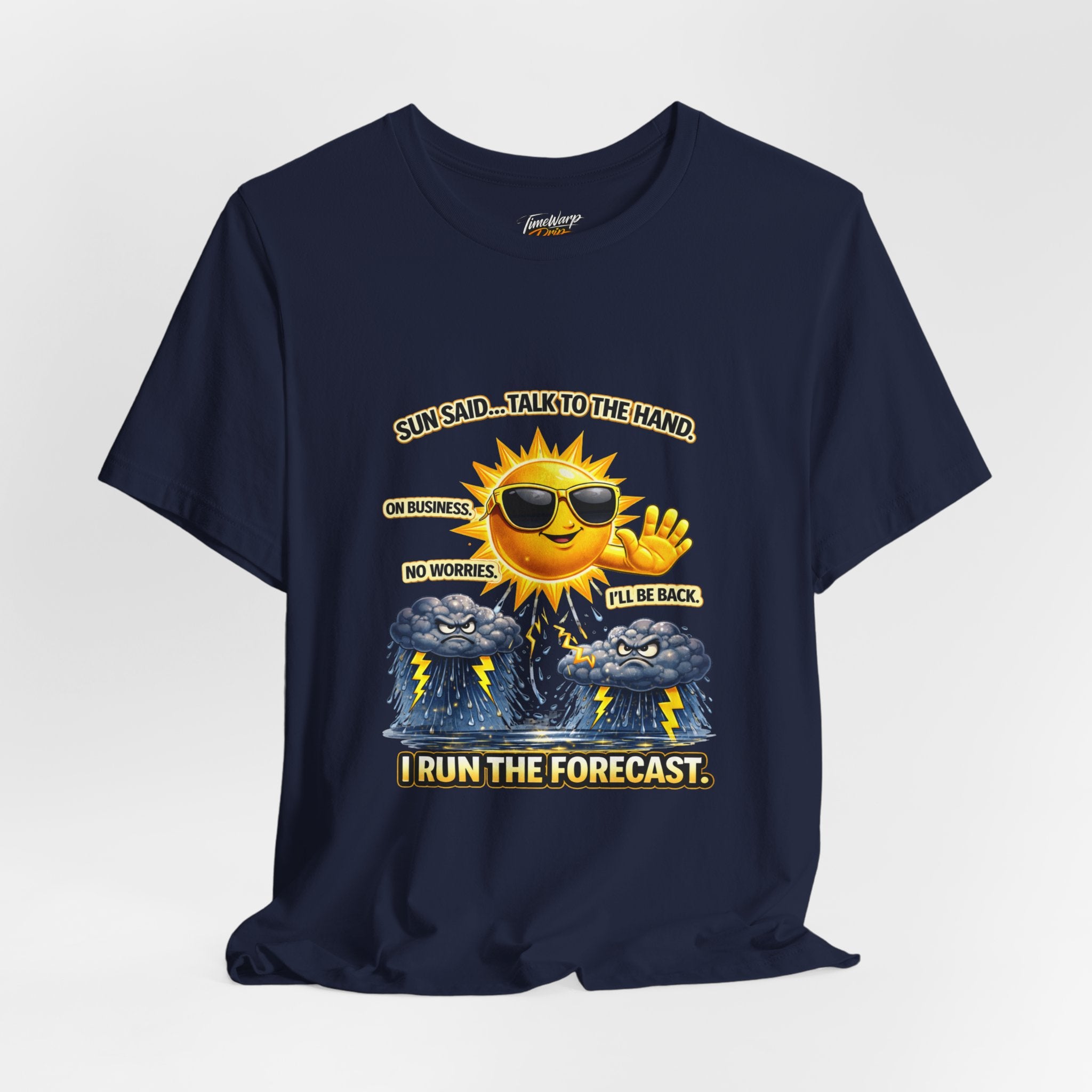 The TimeWarp Drip Calm Energy Vibes T-Shirt — "I Run the Forecast" CEO Energy is a navy blue Airlume cotton tee with a smiling sun in sunglasses, hand raised, above storm clouds. Text: Sun said... talk to the hand. On business. I run the forecast.