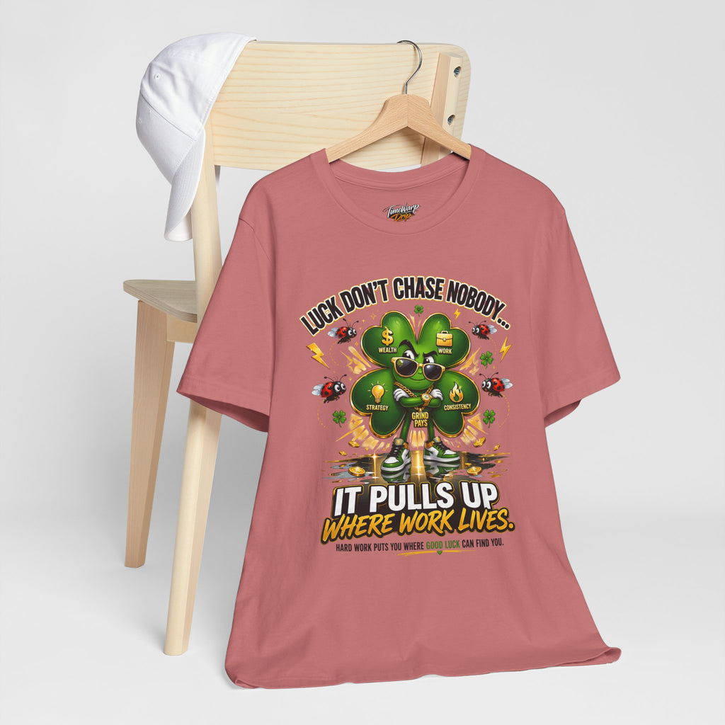 TimeWarp Drip Luck Don’t Chase Nobody black tee by Printify drips on a chair, flexin’ next to a crisp white cap—streetwear icon. streetwear apparel