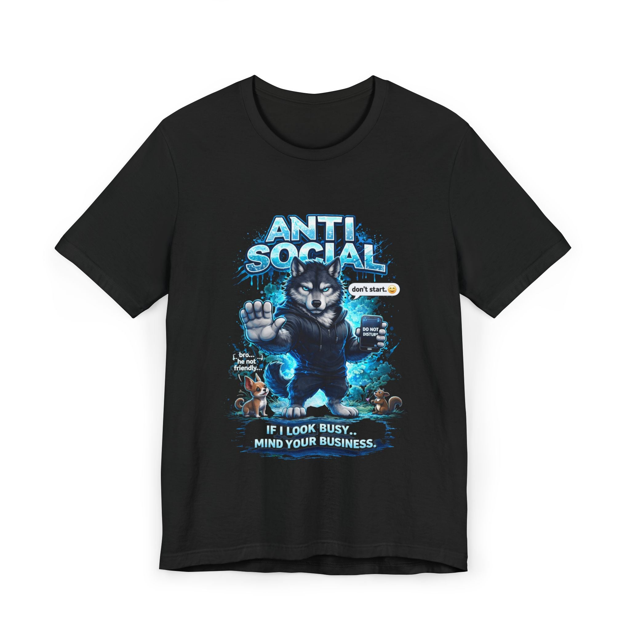 The Anti Social Wolf T-Shirt features a grumpy wolf with one paw up, speech bubbles, blue splashes, and the phrases "ANTI SOCIAL" and "IF I LOOK BUSY... MIND YOUR BUSINESS." A perfect funny introvert graphic tee.