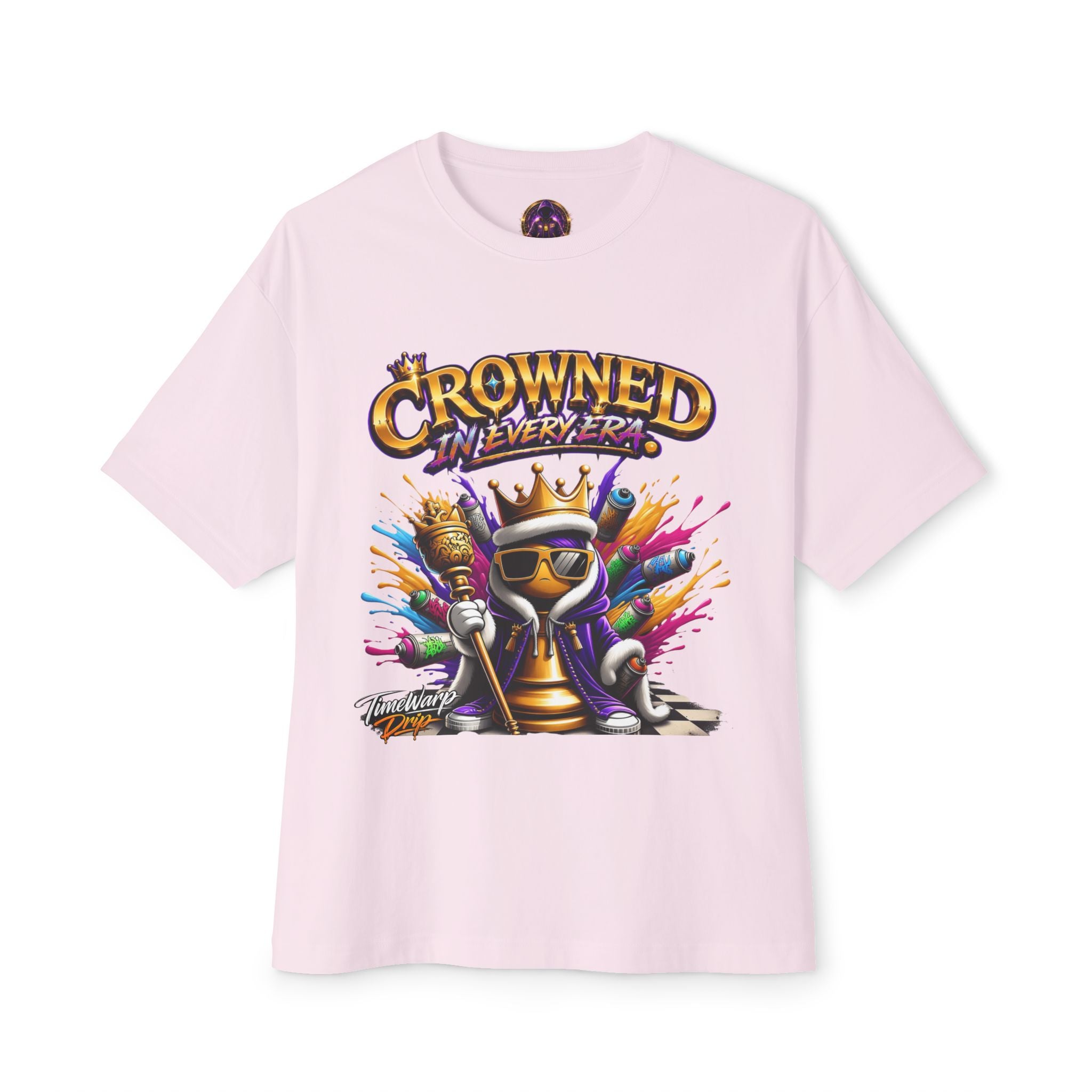The Crowned In Every Era Unisex Oversized Boxy Tee is a light pink, 100% airlume cotton shirt with a crowned cartoon in sunglasses, spray paint splashes, and "CROWNED IN EVERY ERA" text on a relaxed, boxy fit.